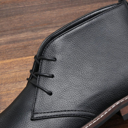 Sleek side profile of men's black chukka boots, versatile and modern footwear.