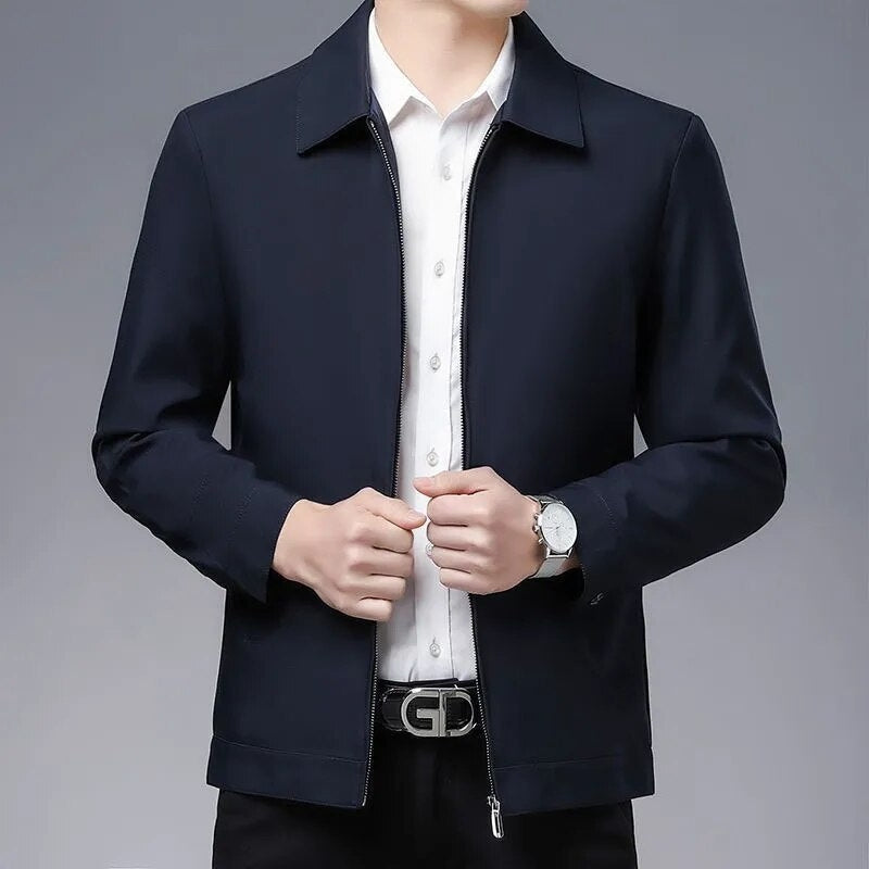 Back view of a men's modern fit everyday jacket in a dark color, showcasing its sleek and stylish design.