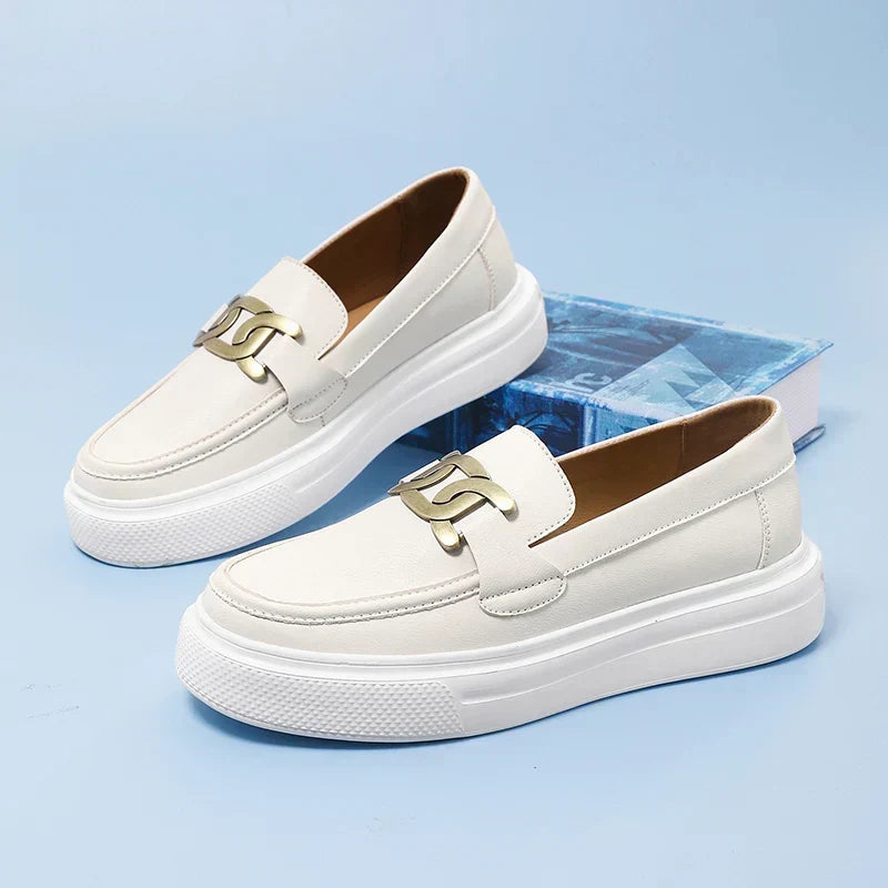 Men's stylish black leather buckle loafers; modern slip-on dress shoes for business casual or formal wear.