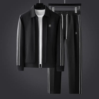 Men's stylish black & white striped activewear set. Two-piece athleisure outfit for comfort & modern fashion.