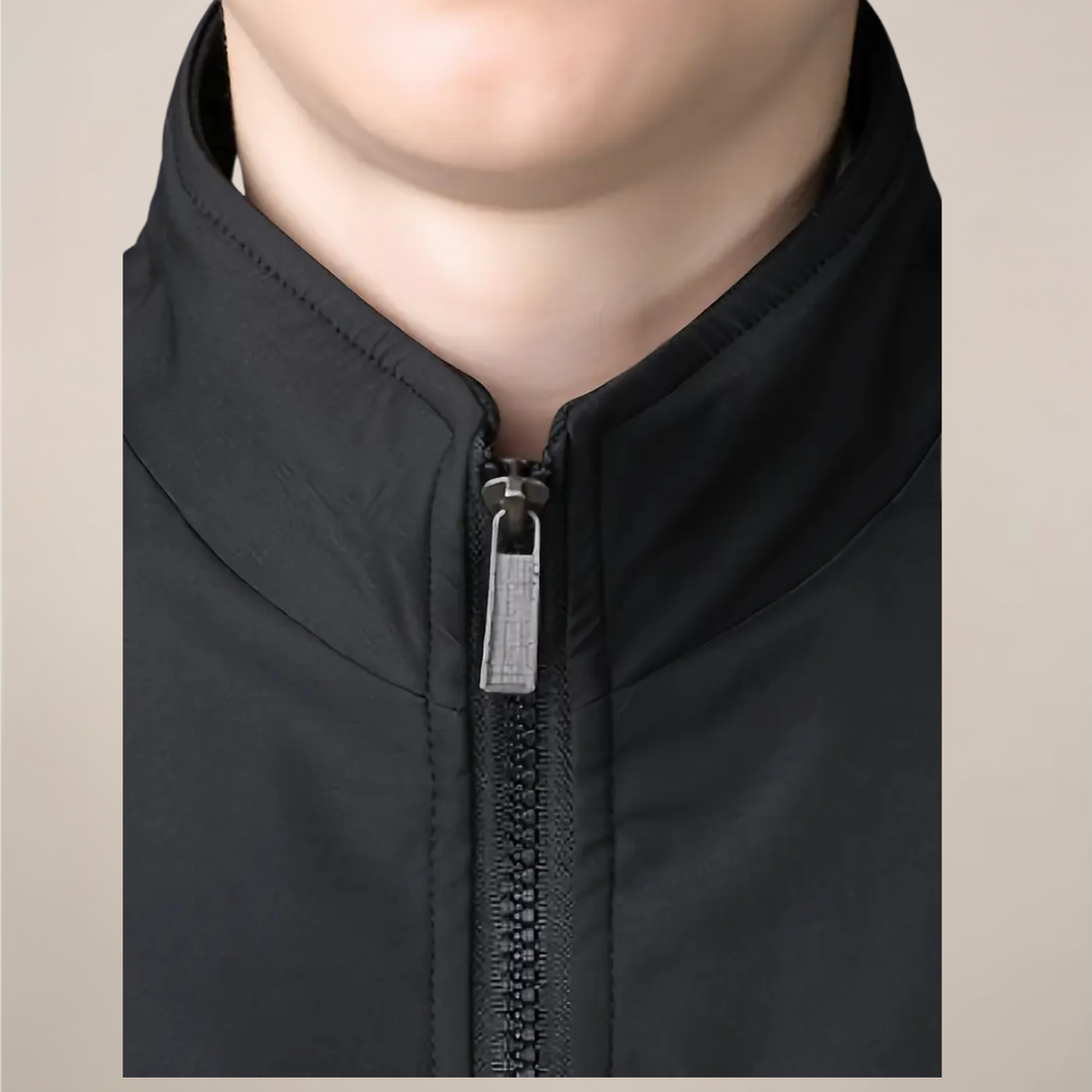 Man wearing a warm lined zip-up winter jacket, showcasing its casual style and cold weather protection.