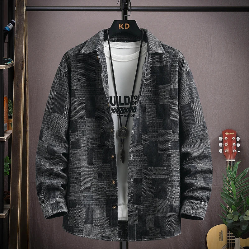 Effortlessly stylish men's relaxed fit patchwork denim shirt with snap closures. Perfect for modern casual looks.