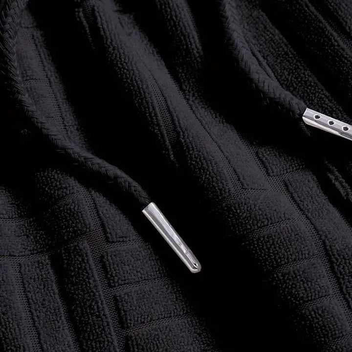 Detail of men's comfort lounge ensemble fabric, highlighting the soft texture and relaxed fit of the two-piece set.