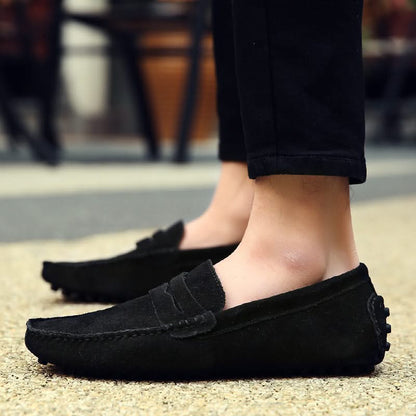 Close-up of men's stylish slip-on loafers, highlighting texture and sophisticated design for comfort.