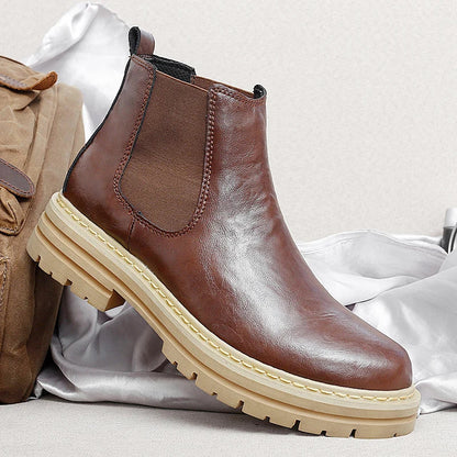 Men's stylish brown Chelsea boots, perfect for both casual and dressy occasions.