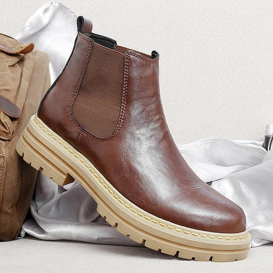 Men's stylish brown Chelsea boots, perfect for both casual and dressy occasions.