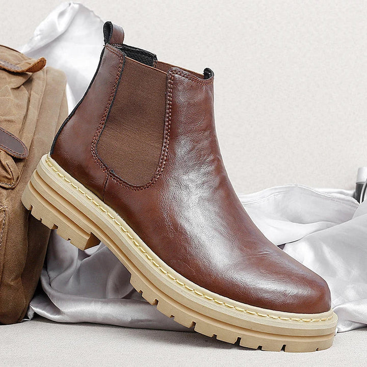 Men's stylish brown Chelsea boots, perfect for both casual and dressy occasions.