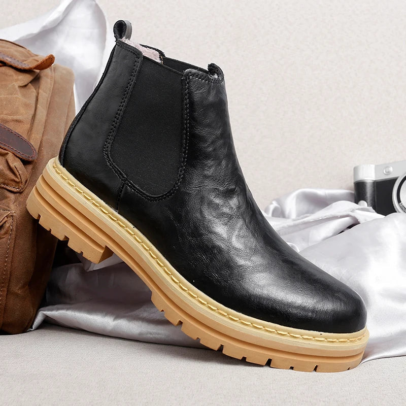 Detailed close-up of a men's stylish leather Chelsea boot, highlighting texture & craftsmanship.