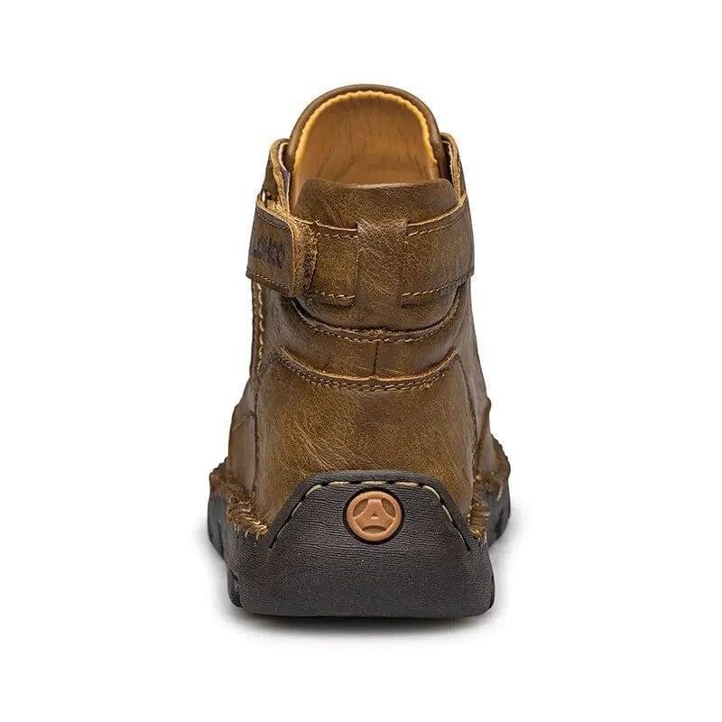 Close-up of men's black PU leather ankle boots with durable non-slip sole for outdoor adventures