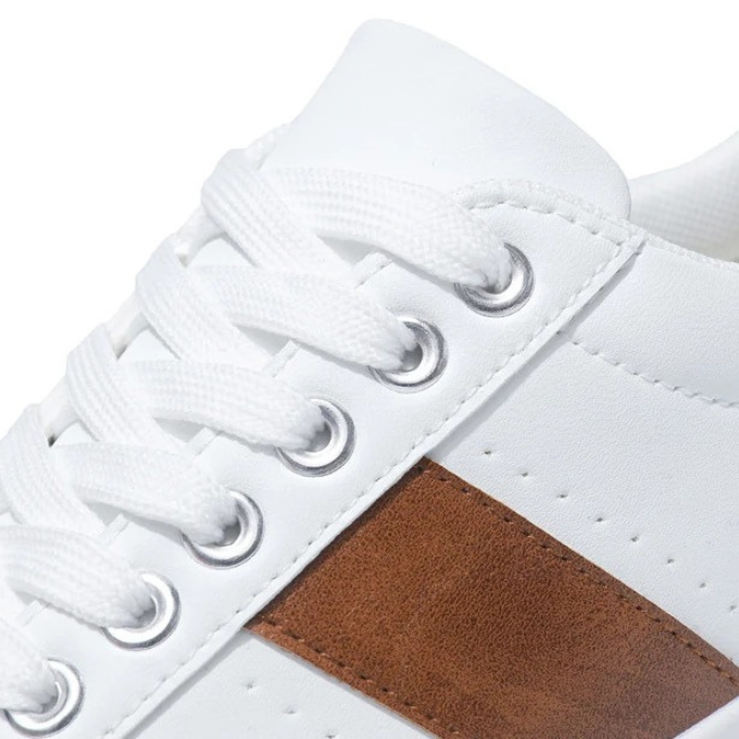 Pair of men's casual sneakers, black & white options shown, stylish & comfortable everyday footwear.