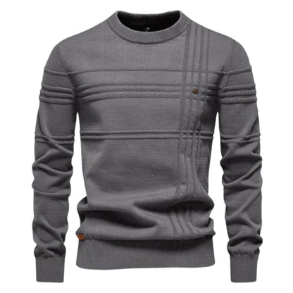 Comfortable men's long sleeve sweater, versatile for casual or smart-casual occasions with refined details.