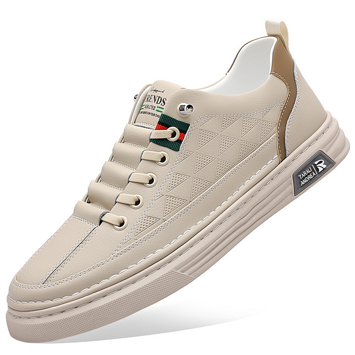 Fashion-forward men's sneakers. Embossed design elevates these casual shoes to a new level of style.