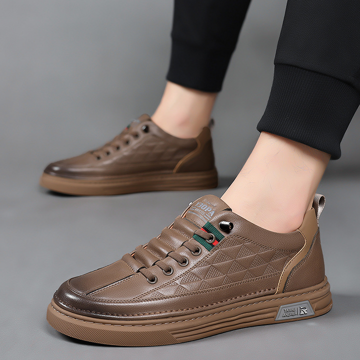 Comfortable men's footwear: stylish casual sneakers with unique embossed design, ideal for all-day wear.