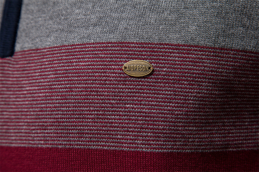 Modern men's half-zip sweater with colorblock design, ideal for sophisticated layering.