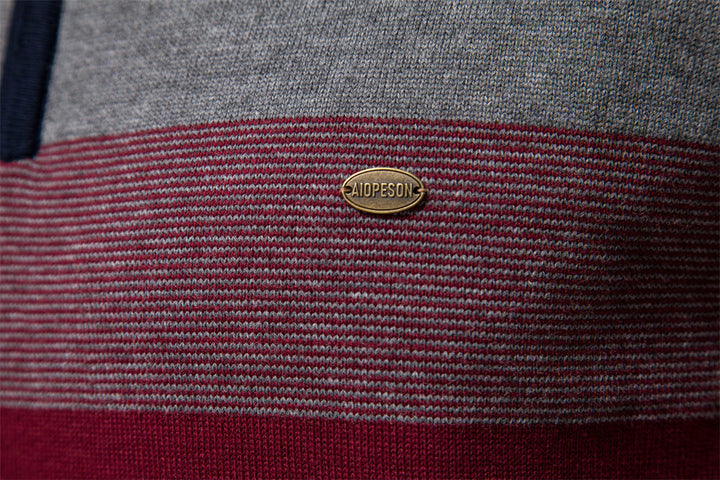 Modern men's half-zip sweater with colorblock design, ideal for sophisticated layering.