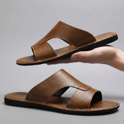 Durable men's cross-strap slip-on sandals, great comfort footwear for beach, pool, and warm weather.