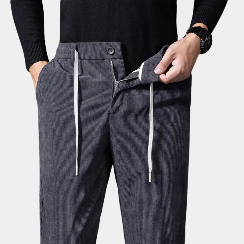Modern men's corduroy trousers, featuring stretch fabric and a comfortable flexible waist for everyday wear.