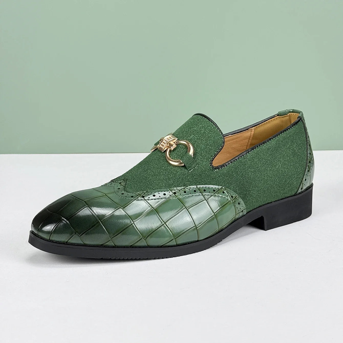 Stylish green croc-embossed loafers for men. Comfortable slip-on casual shoes with a unique textured design.