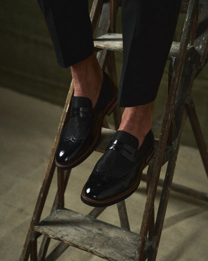 Modern classic men's wingtip loafers, sleek design for stylish fashion.
