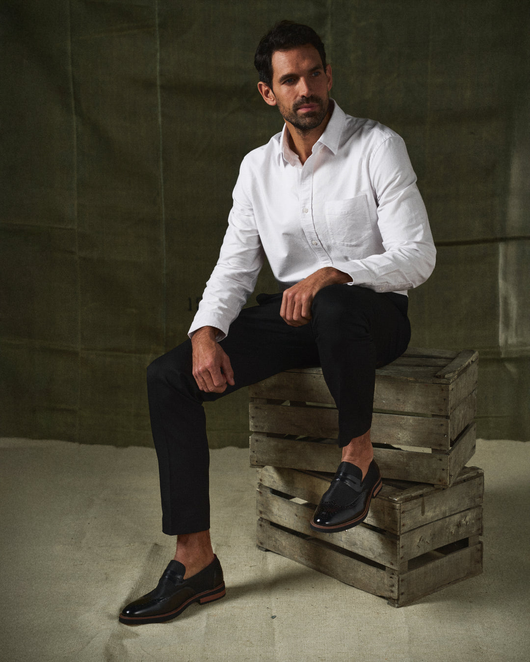 Front view: Men's elegant hybrid wingtip loafers, comfortable slip-on office shoes.