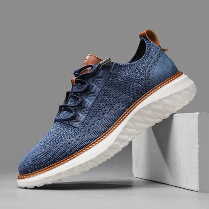 Comfortable men's blue knit athletic-style sneakers, perfect for casual wear & daily activities.
