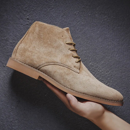 Stylish men's brown lace-up Chelsea boots worn with jeans, offering comfort & rugged style for everyday adventures.