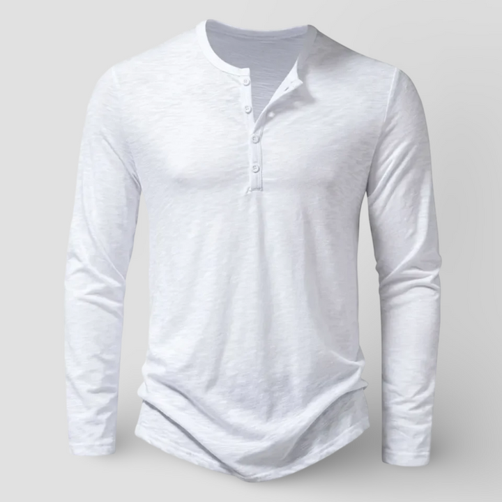 Man wearing a comfortable & versatile long sleeve henley shirt. This essential men's top is great for casual fashion.