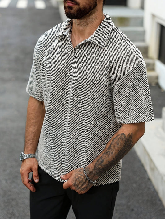 Men's stylish Monaco polo shirt, textured fabric, short sleeve, oversized fit, perfect for warm weather and casual style.