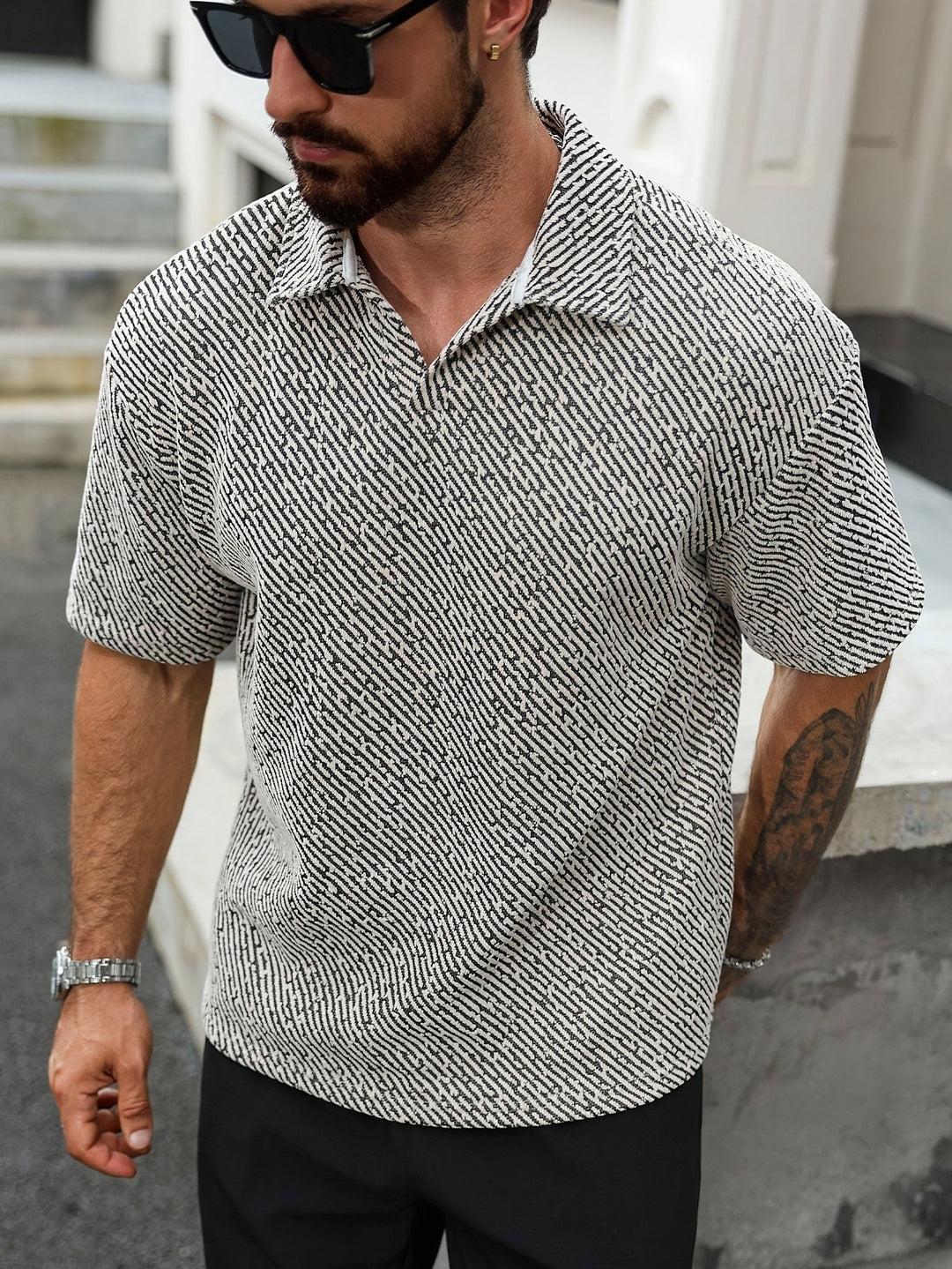 Stylish men's textured Monaco polo shirt, relaxed fit, short sleeve, perfect for modern men's summer fashion.
