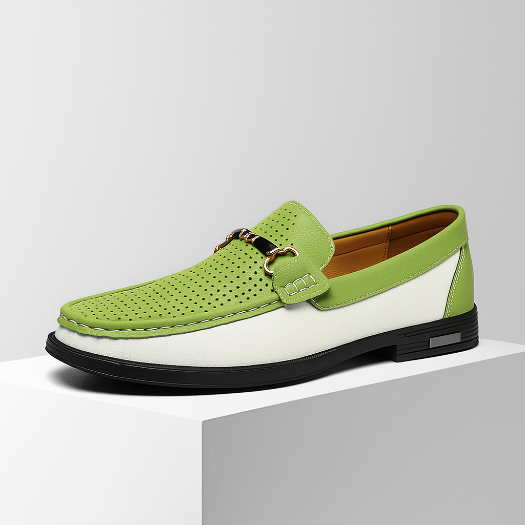 Close-up of men's elegant bit loafers, showing intricate perforated detailing & comfort.