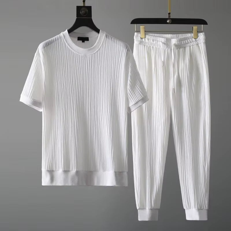 Stylish men's pleated two-piece lounge set, relaxed fit for comfortable casual wear & modern off-duty look.