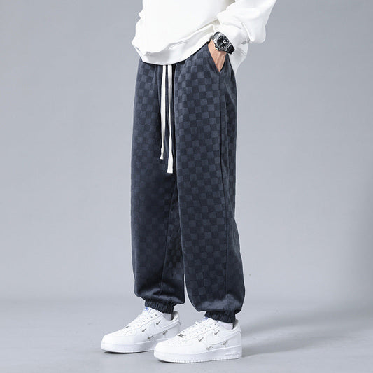 Men's stylish relaxed-fit checkerboard sweatpants, perfect for casual comfort & streetwear fashion.