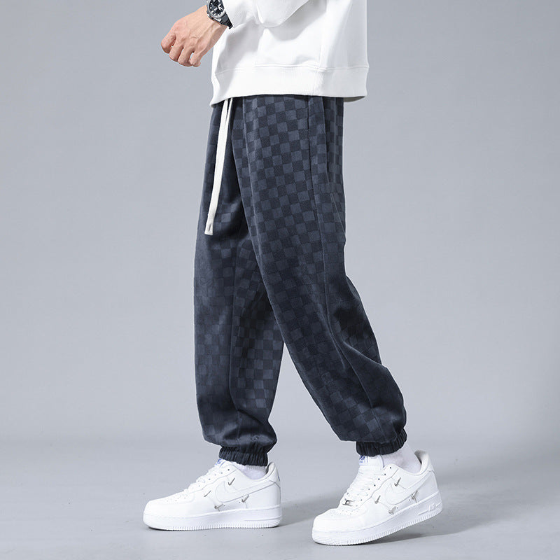 Streetwear checkerboard sweatpants for men, offering a relaxed fit and modern style for active or lounge wear.