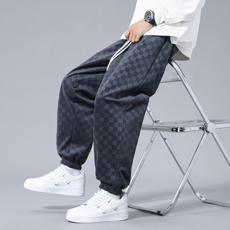 Comfortable men's checkerboard track pants, relaxed fit ideal for lounging, activewear, or casual outings.
