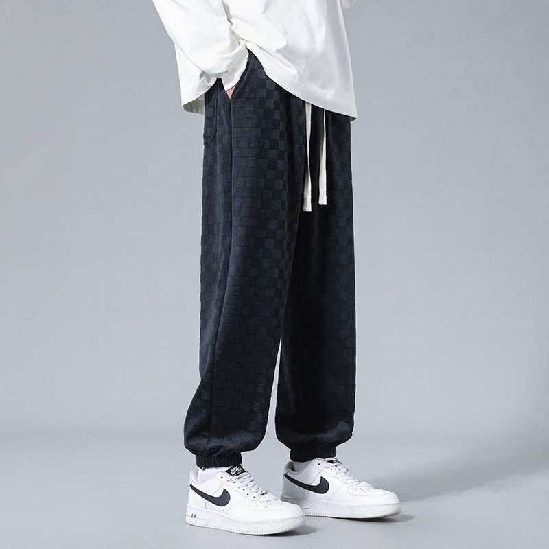Versatile men's relaxed-fit checkerboard joggers, suitable for casual comfort, activewear, or trendy streetwear.