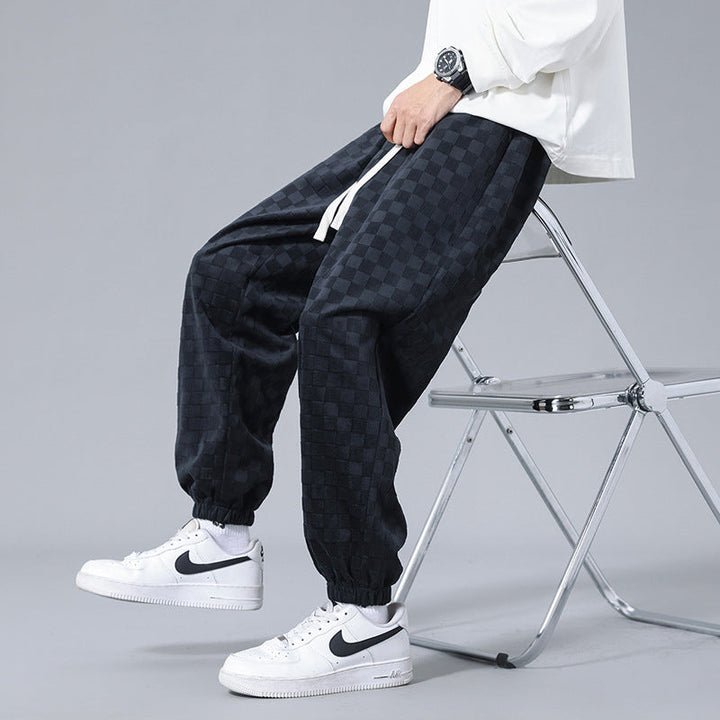 Men's relaxed-fit checkerboard sweatpants, ideal for streetwear, lounge wear, or casual comfort.