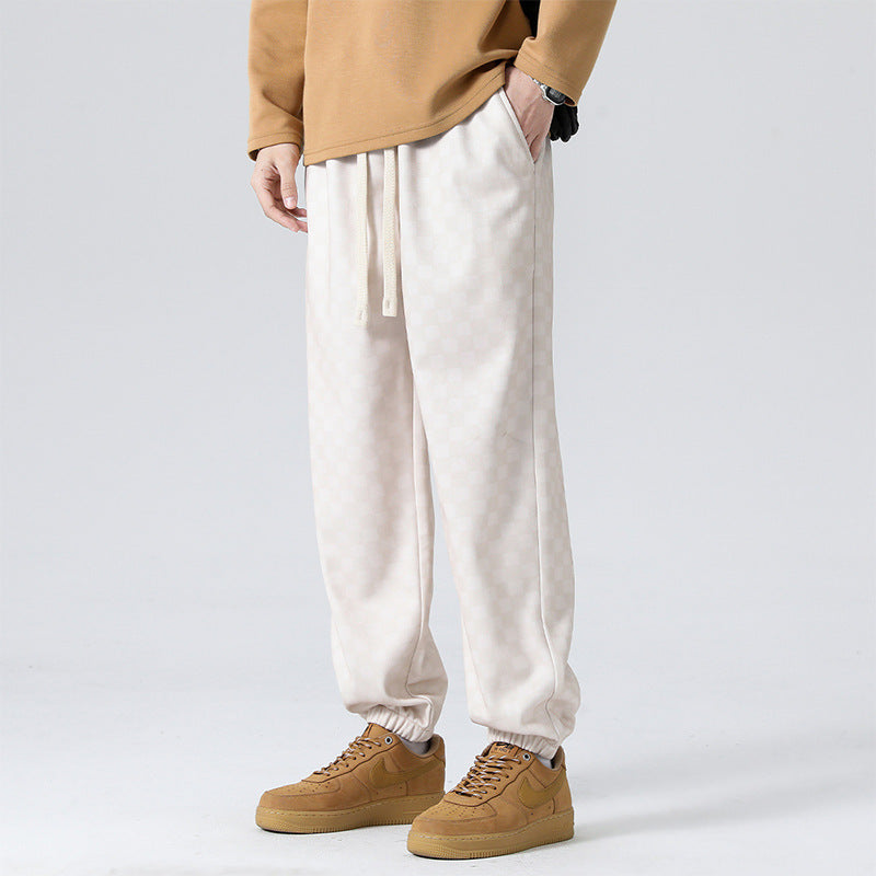 Men's stylish checkerboard joggers in a relaxed fit, perfect for an active lifestyle or casual comfort.
