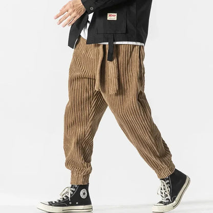 Men's stylish relaxed fit joggers, perfect for everyday comfort & streetwear. Features elastic waist & ribbed cuffs.