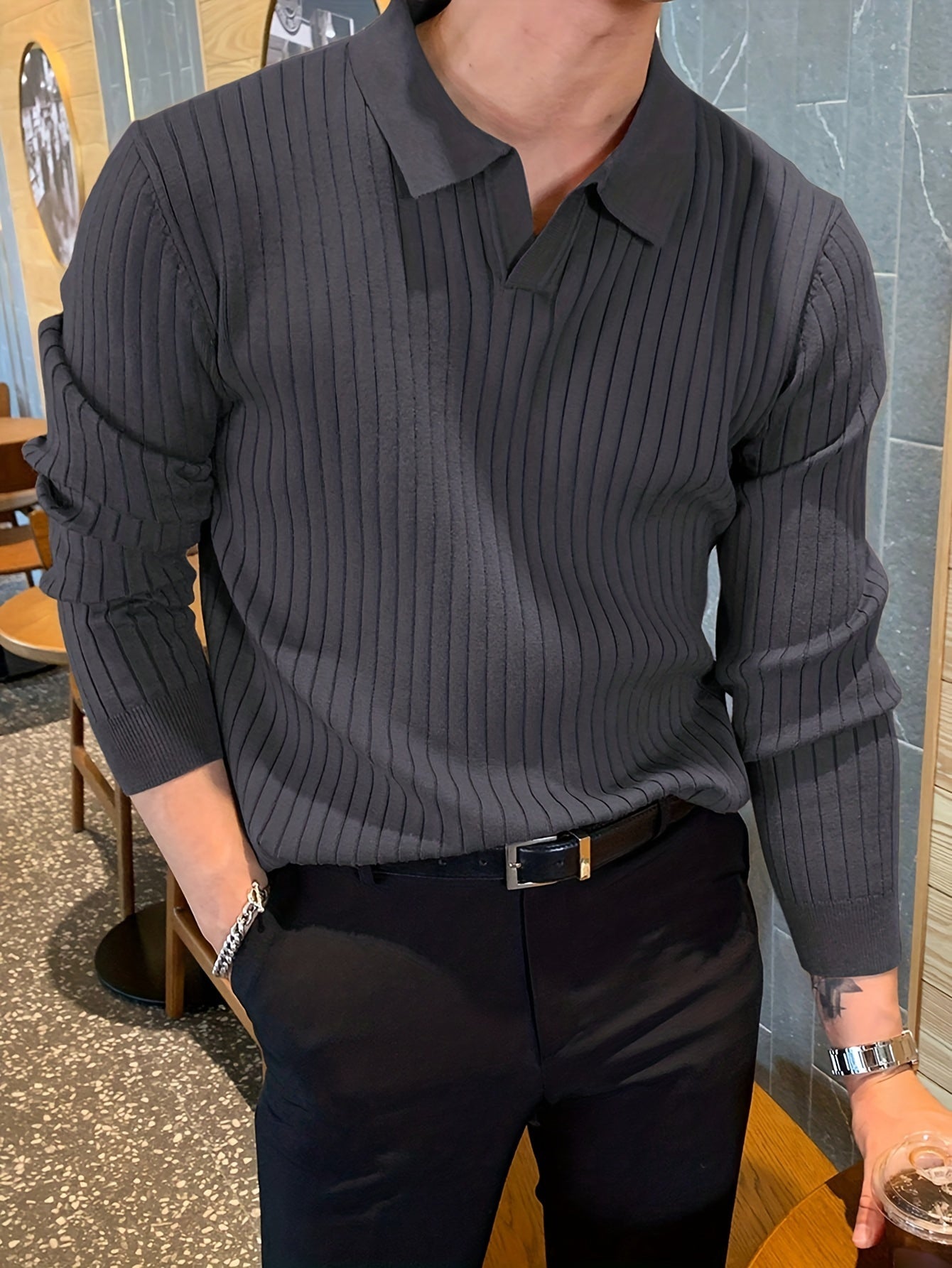 Man models a stylish ribbed knit polo shirt, perfect for refined smart casual looks.