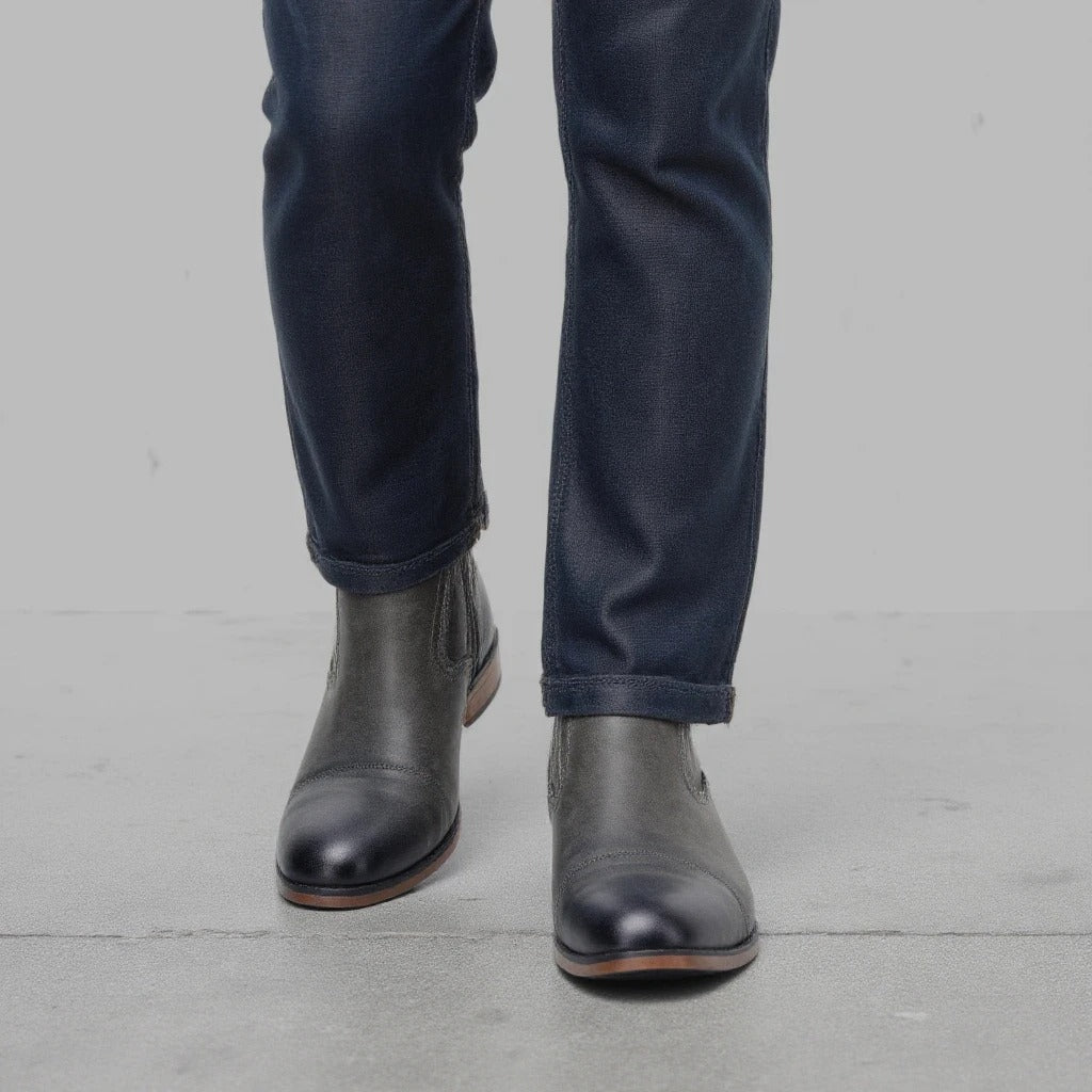 Sleek men's slip-on dress boots: Chelsea style with a practical side zipper.