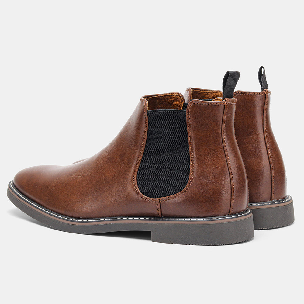 Close-up of men's stylish slip-on Chelsea boots, highlighting the elastic gussets and premium design.