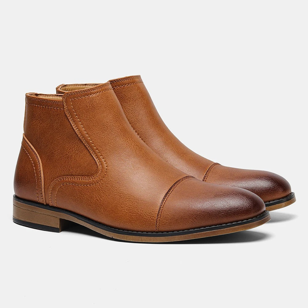 Cap toe men's slip-on Chelsea boots, offering a sophisticated edge to dressy outfits.