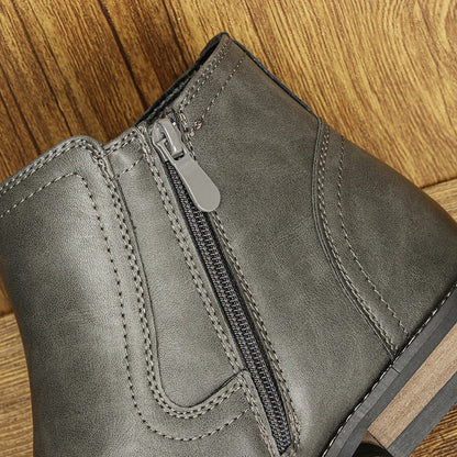 Black leather men's Chelsea boots, slip-on style, ideal for modern urban fashion.