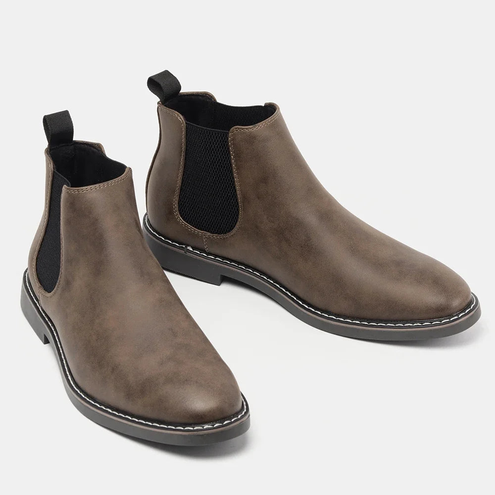Modern men's slip-on Chelsea boots with a sleek design, offering style and comfort for daily wear.