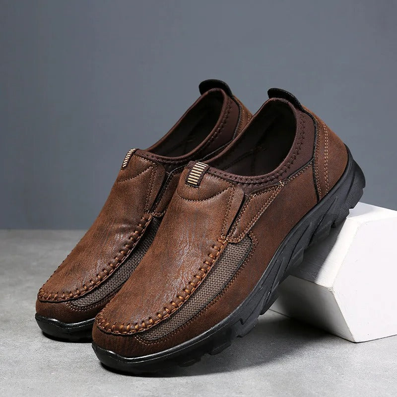 Side profile of stylish men's slip-on loafers, durable and comfortable for walking.