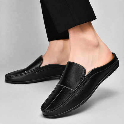 Elegant black men's slip-on mules, offering both sophisticated style and superior comfort.