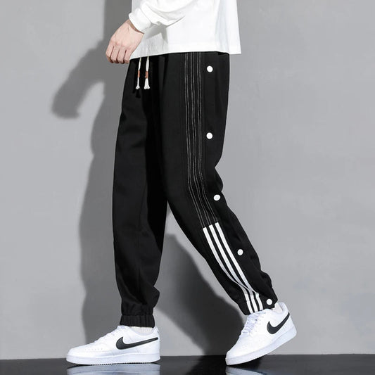 Men's stylish snap-track joggers for street style. Comfortable, relaxed fit casual pants for everyday wear.