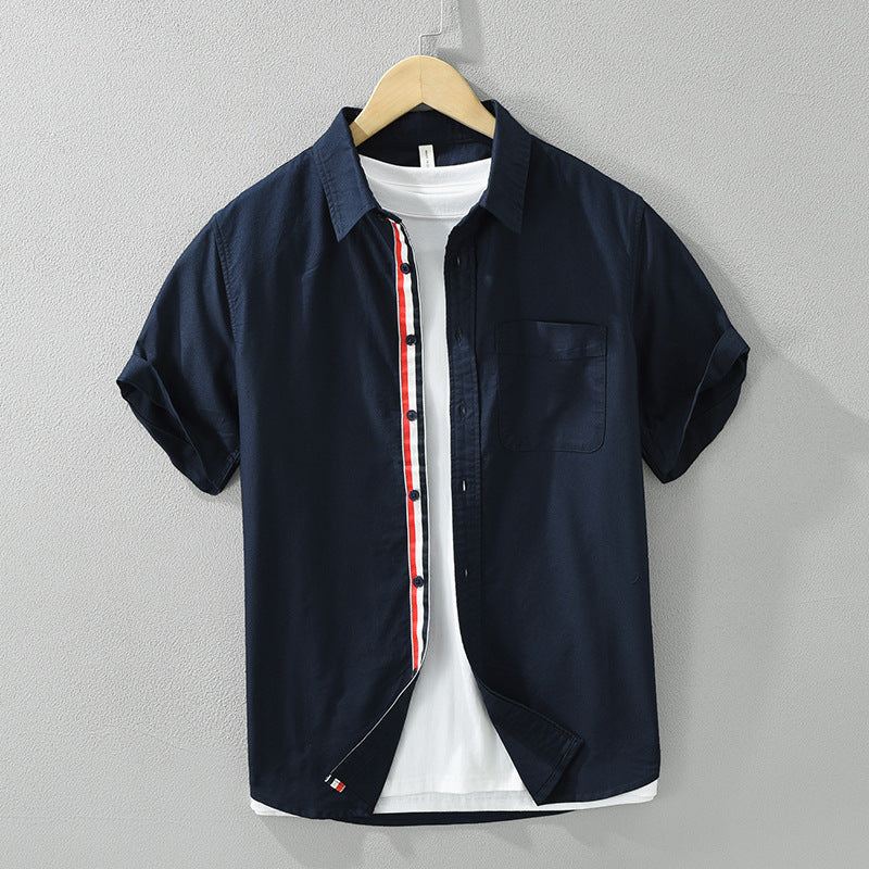 Back view of men's casual striped short-sleeve button-up shirt. Offers a breathable, comfort fit for summer fashion.