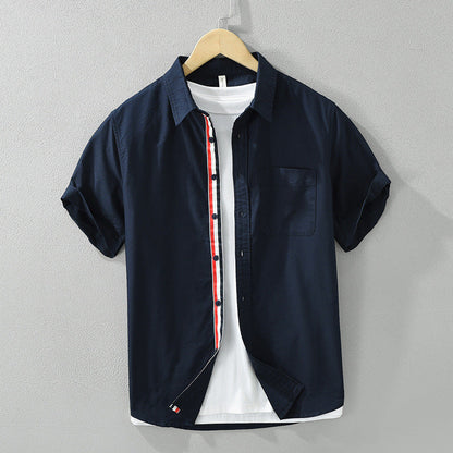 Back view of men's casual striped short-sleeve button-up shirt. Offers a breathable, comfort fit for summer fashion.