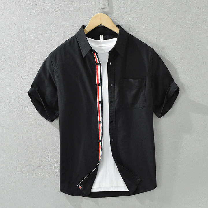 Breathable men's casual striped button-up shirt. Ideal lightweight short-sleeve summer wear for stylish comfort.